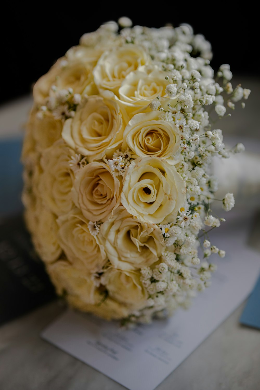 a bridal bouquet of yellow roses and baby's breath