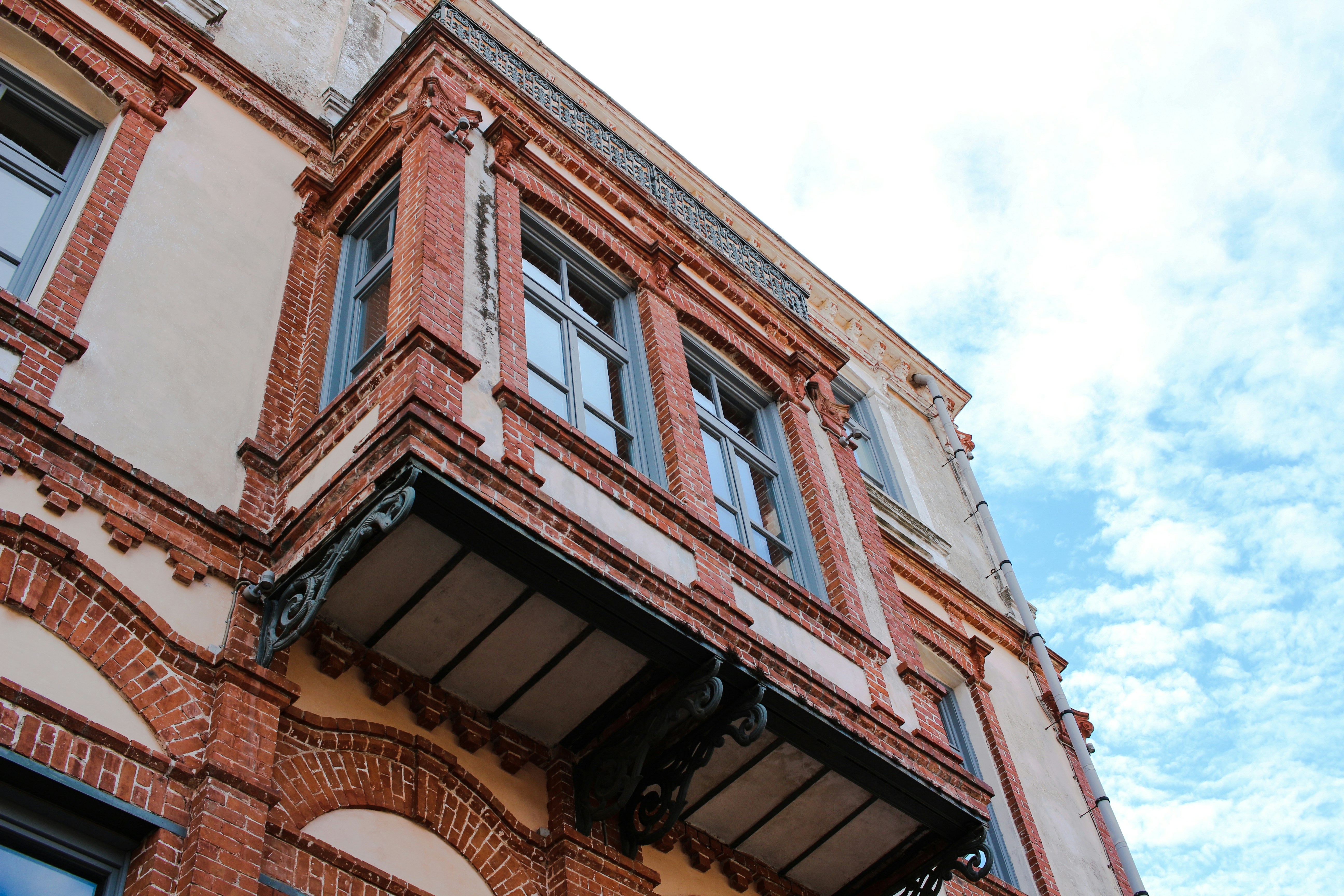 a tall brick building with lots of windows