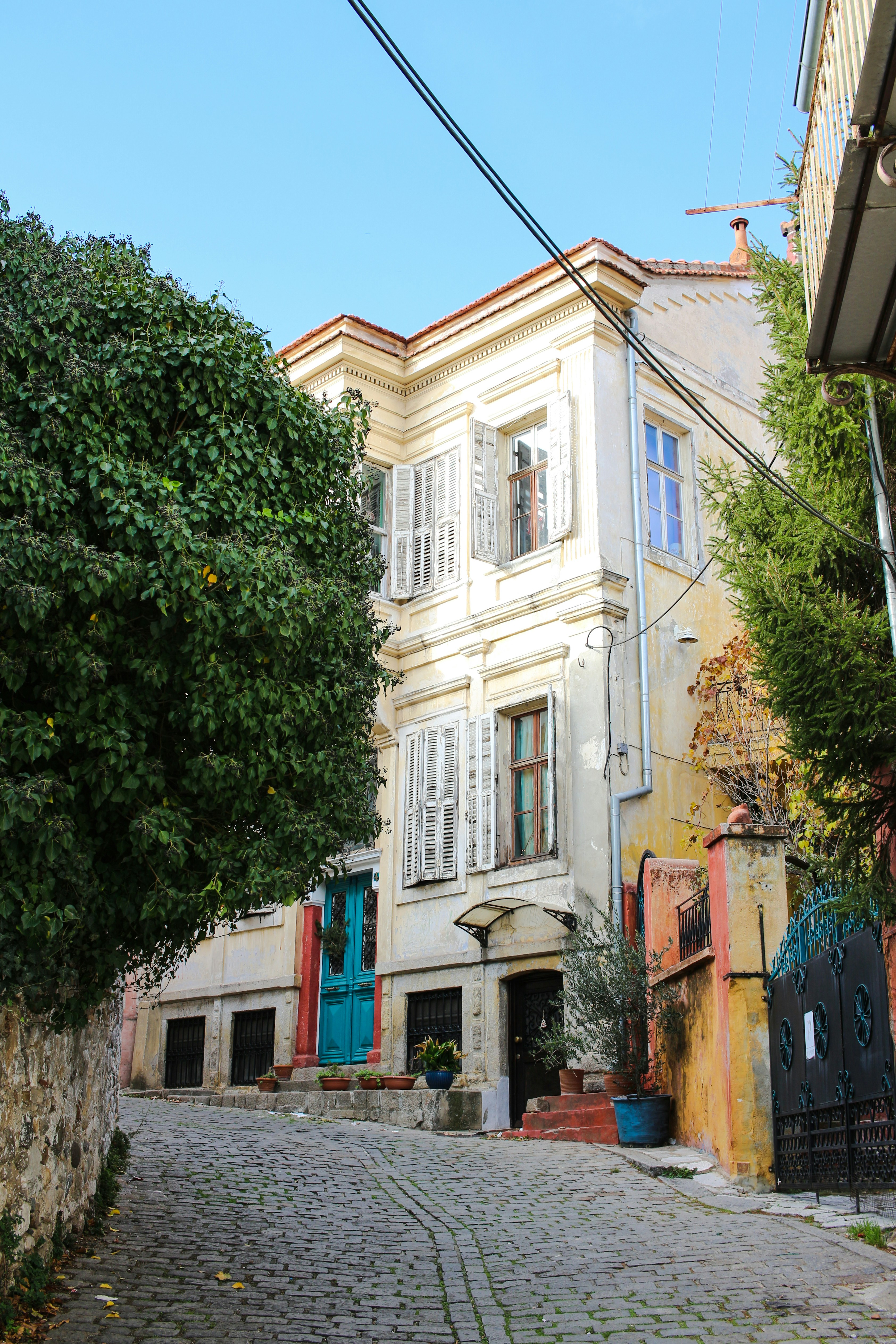 a cobblestone street lined with old buildings