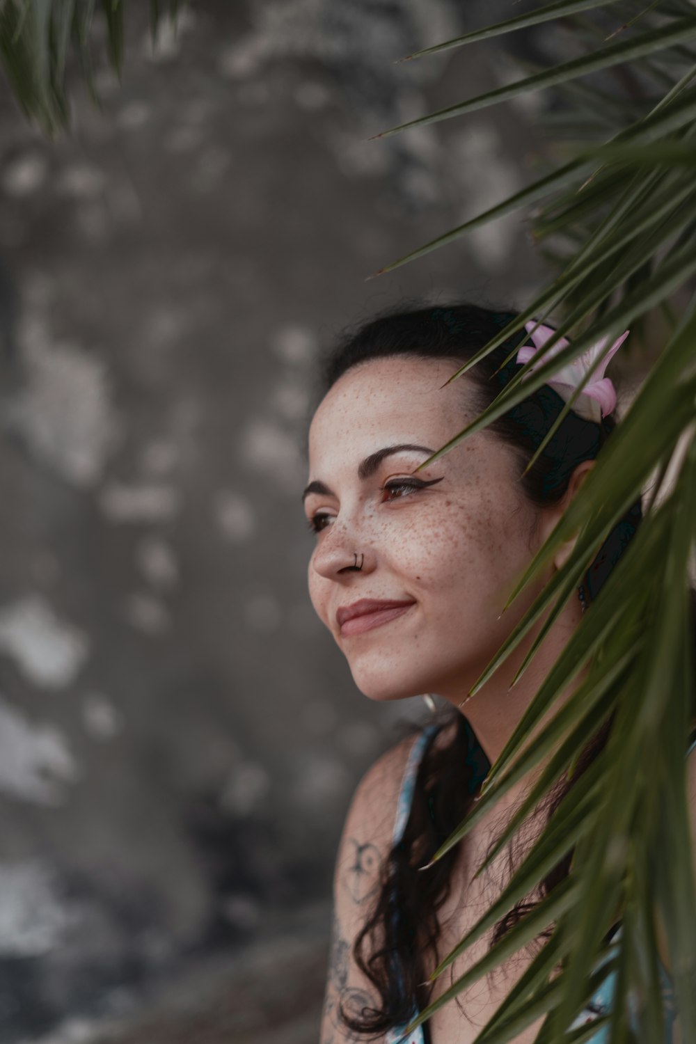 a woman with a flower in her hair