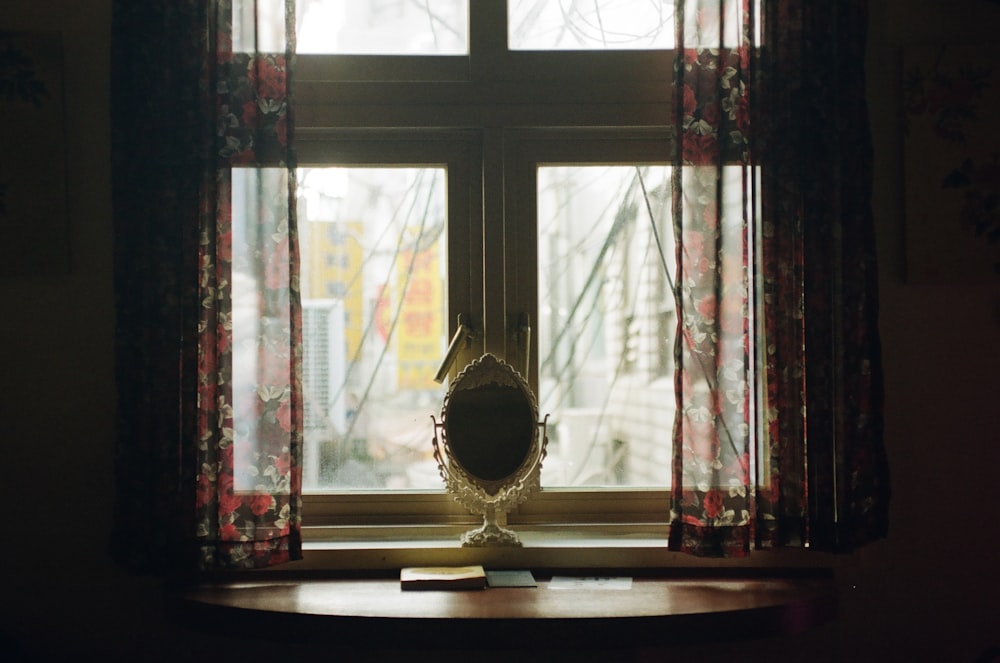 a window sill with a mirror on top of it