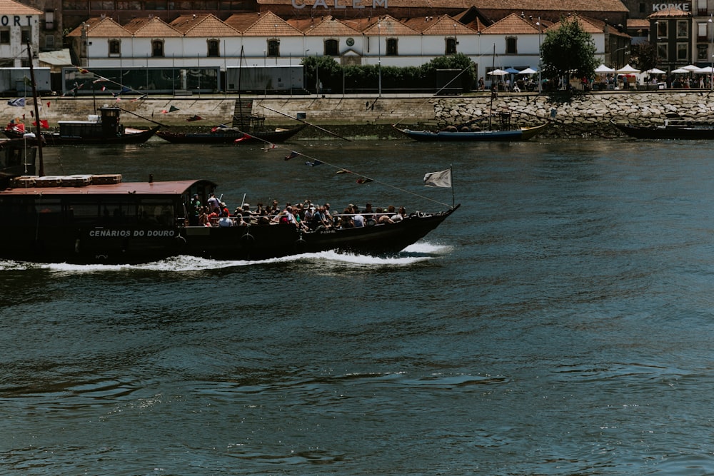 a boat full of people traveling down a river