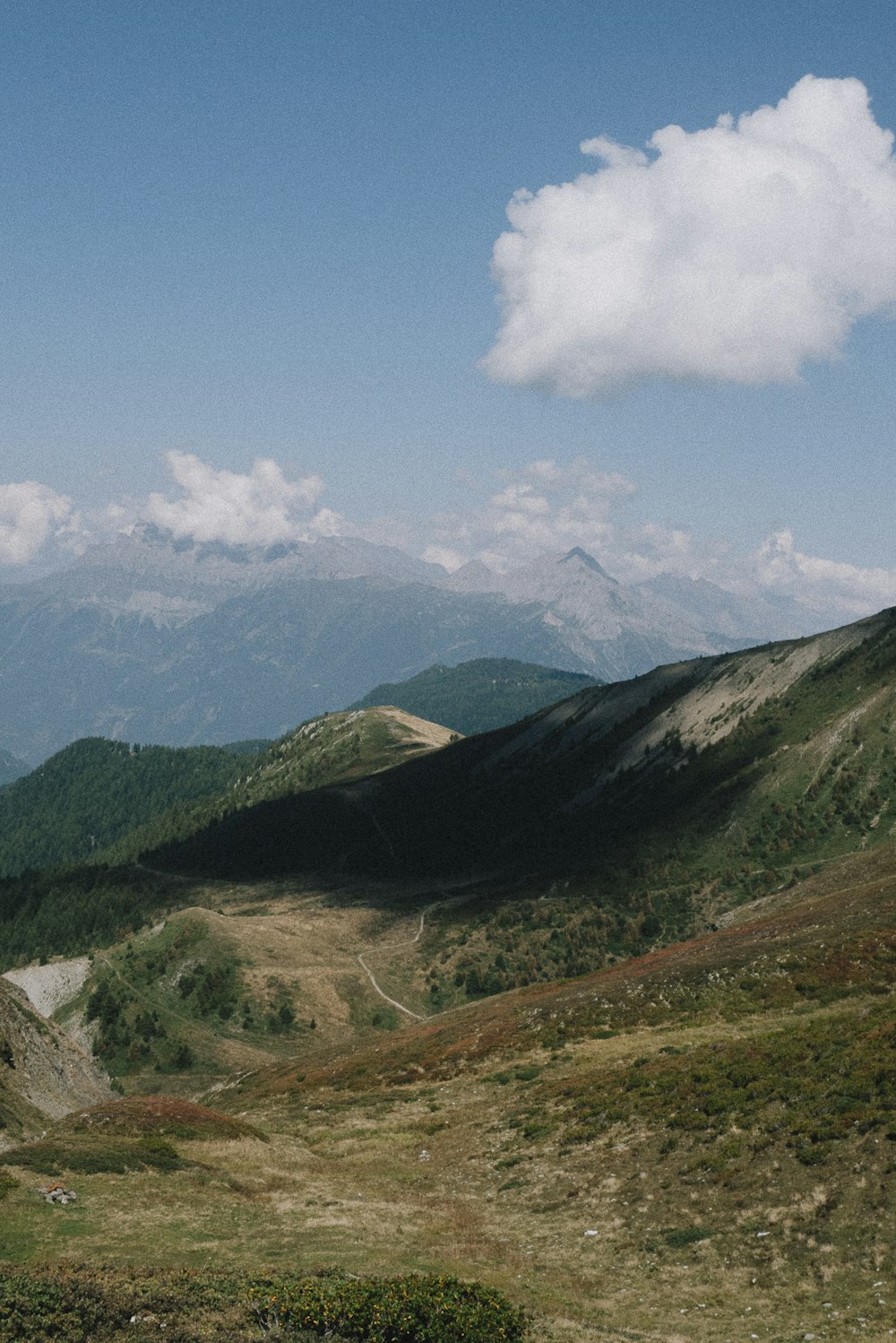 a view of a mountain range with mountains in the background