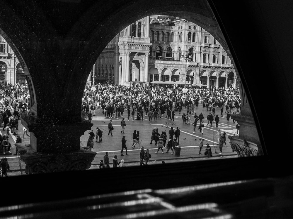 a black and white photo of a crowd of people