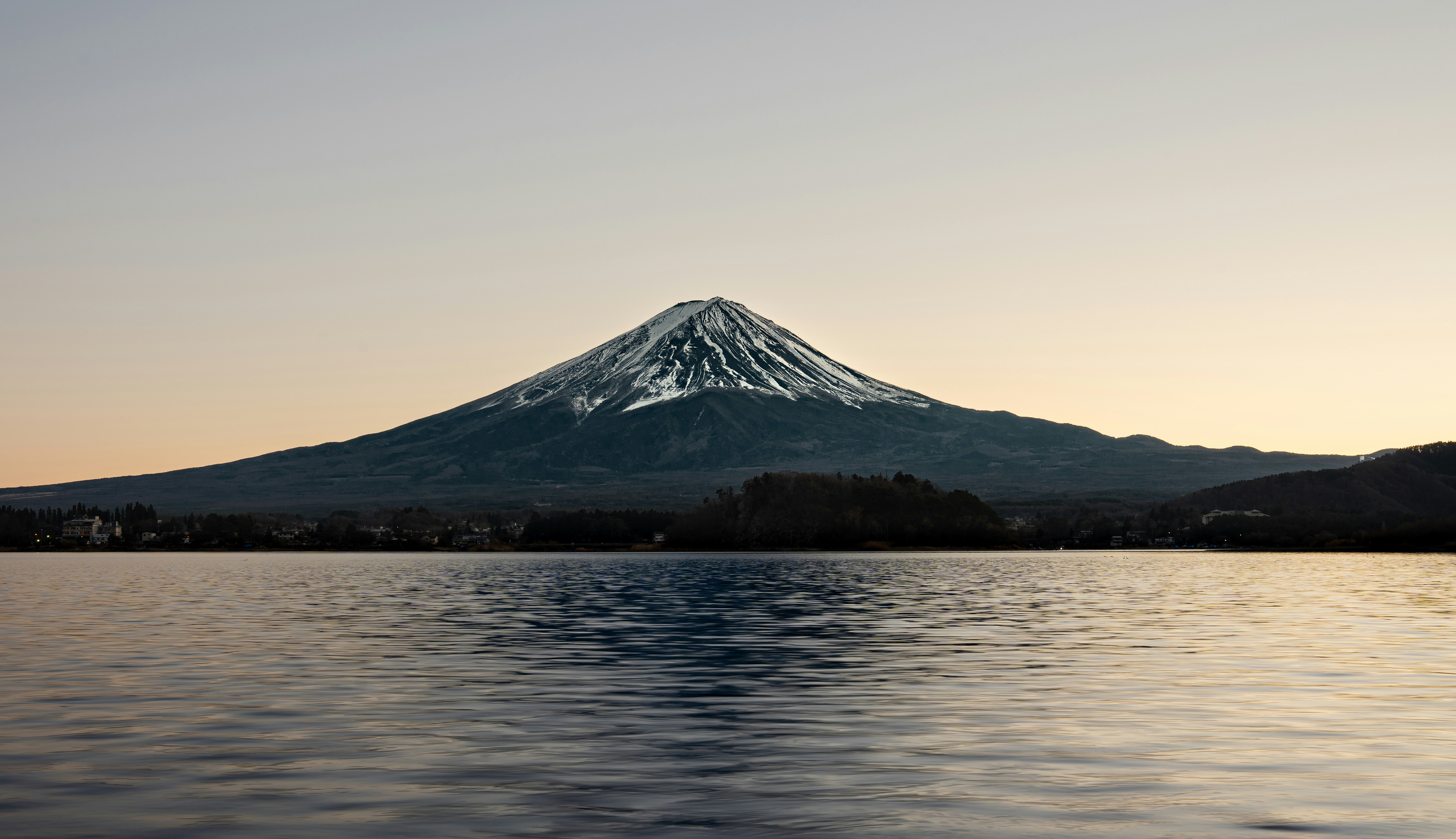 a mountain with a snow covered peak in the distance, 