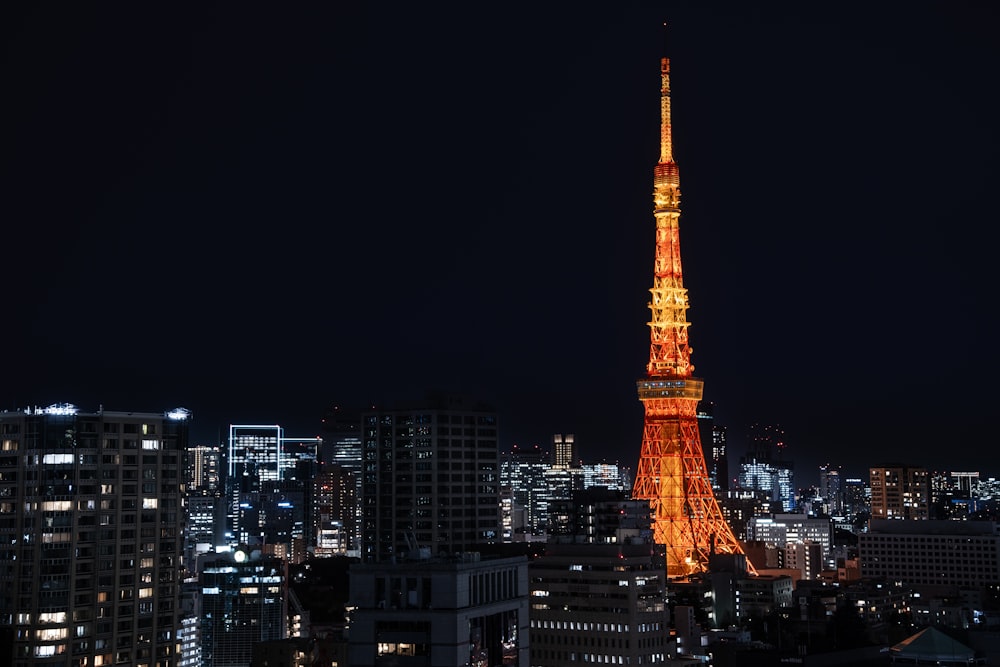 the eiffel tower is lit up at night