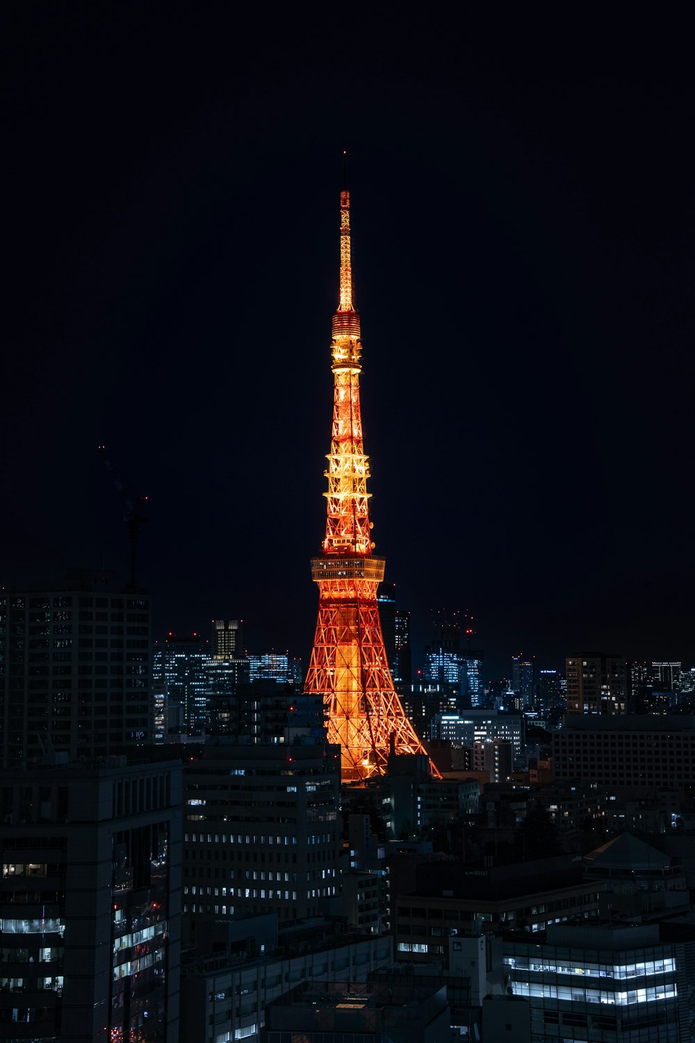 the eiffel tower is lit up at night