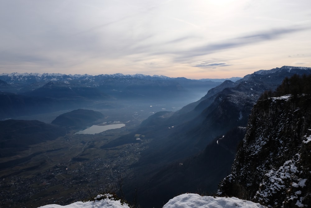 a view of a valley with mountains in the background