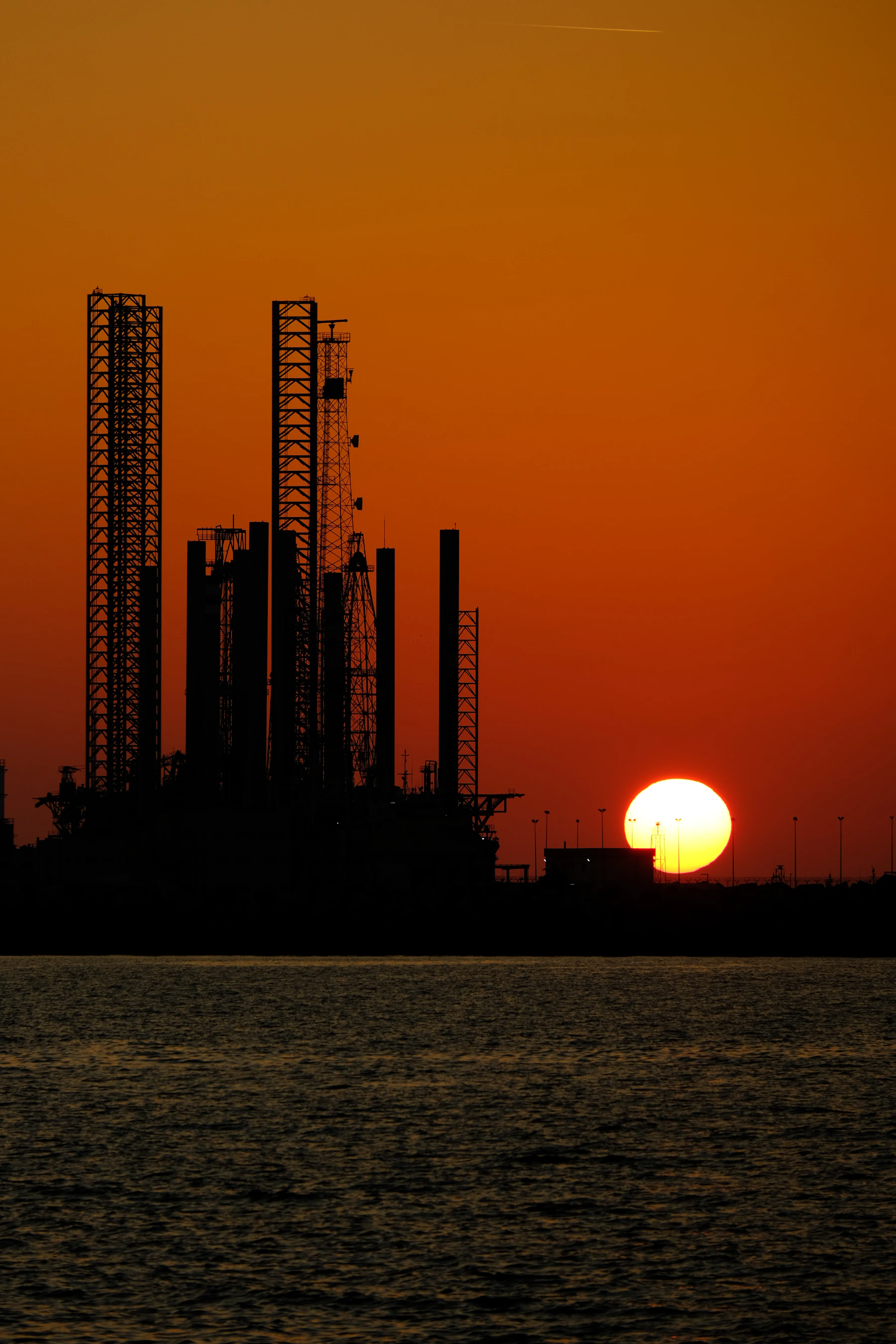 Industrial refinery and energy infrastructure at sunset