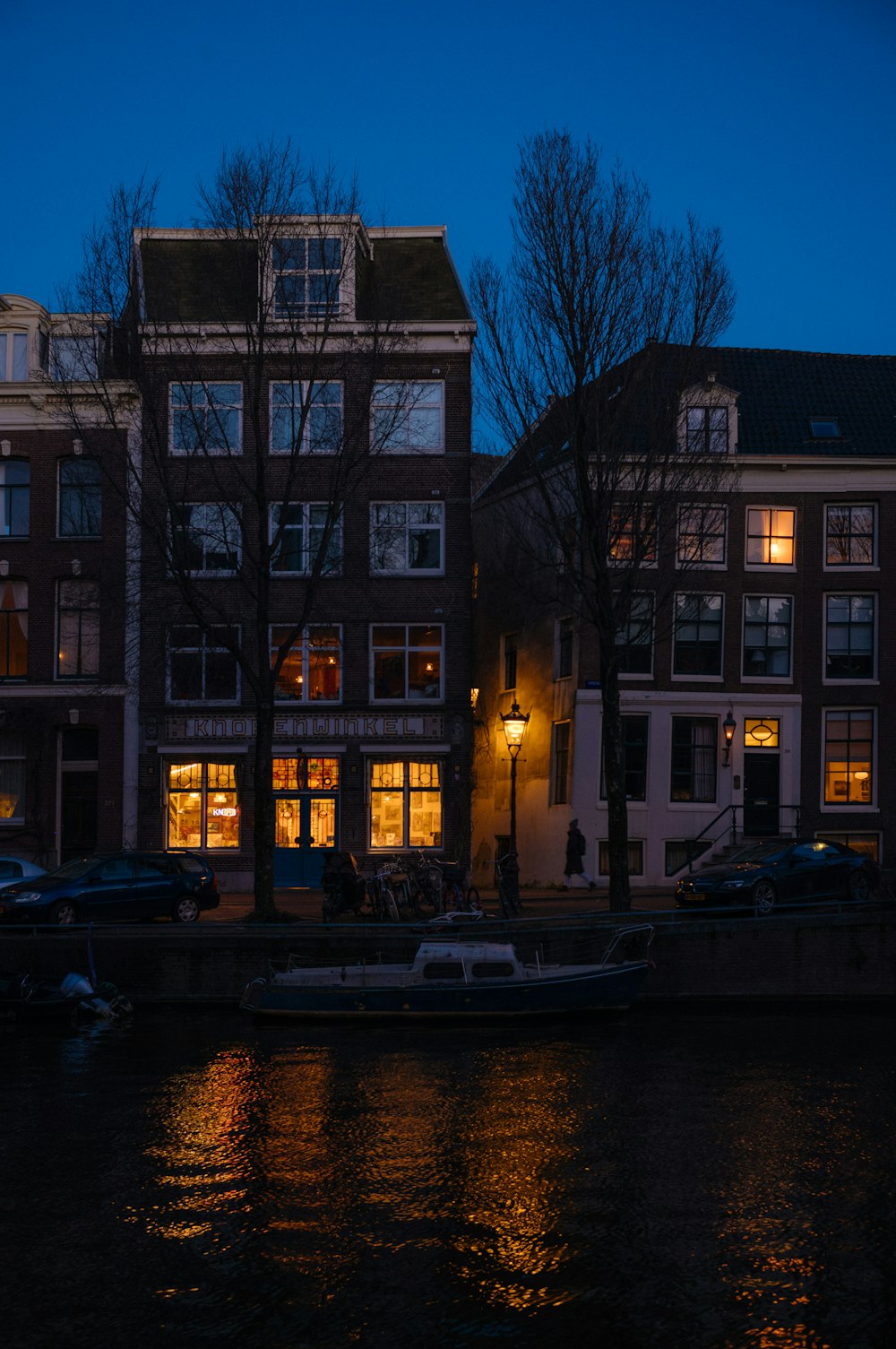 a row of buildings next to a body of water