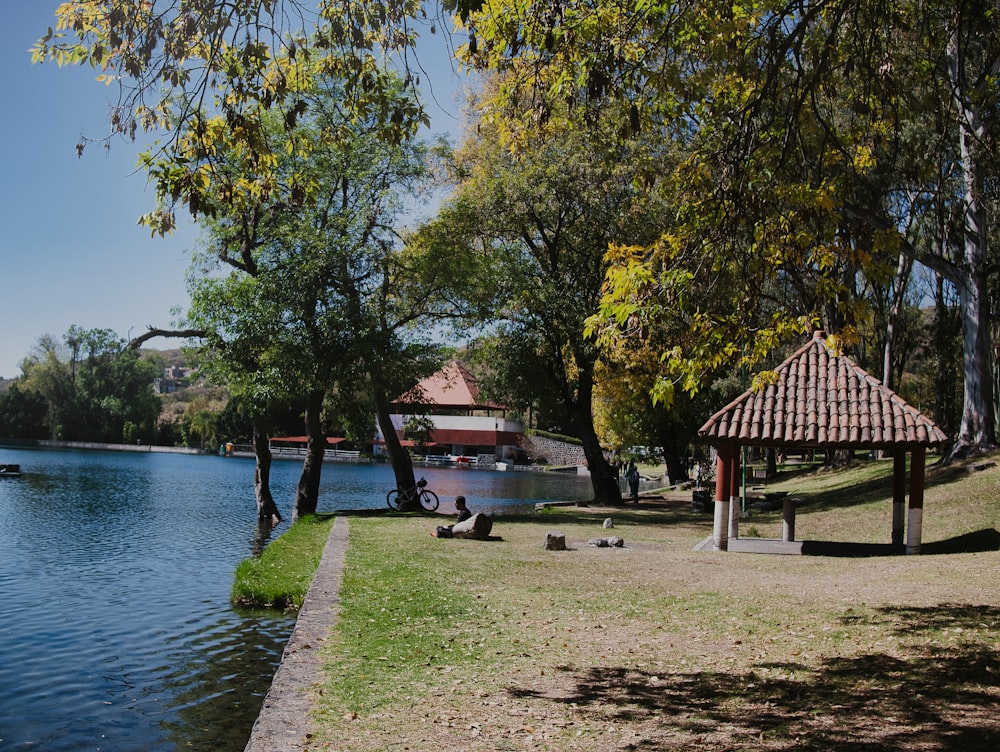 a park with a lake and a gazebo