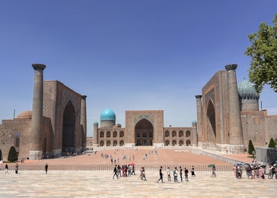 a group of people standing in front of a building