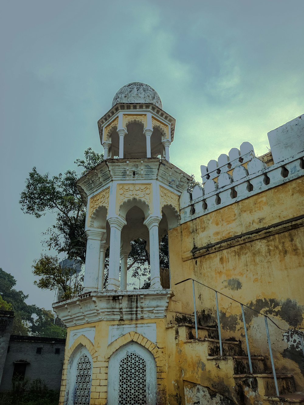 an old building with a clock on the top of it