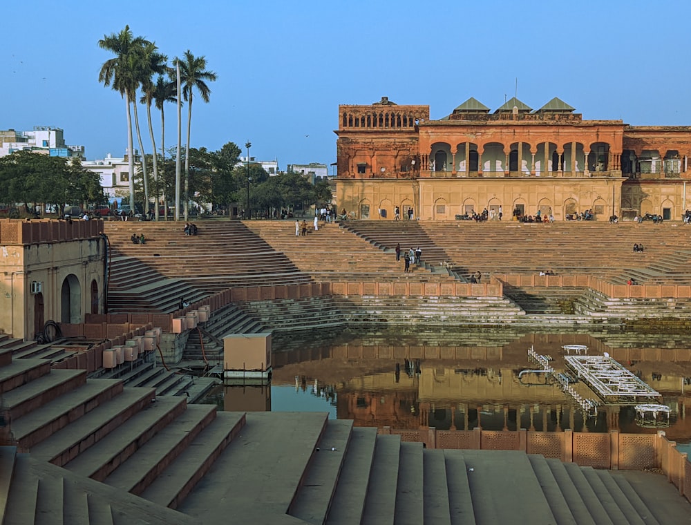 a large building sitting next to a body of water