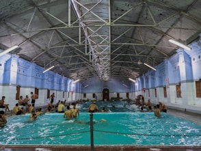 a group of people sitting in a swimming pool