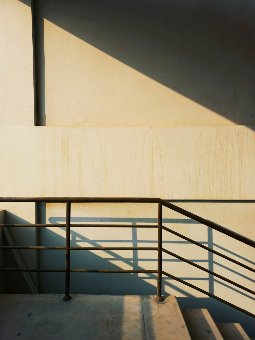 a man riding a skateboard down a metal hand rail