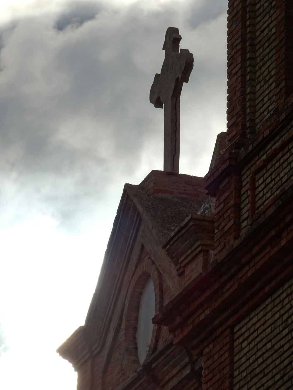 a cross on top of a church steeple