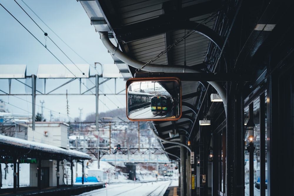 a train on a train track next to a train station