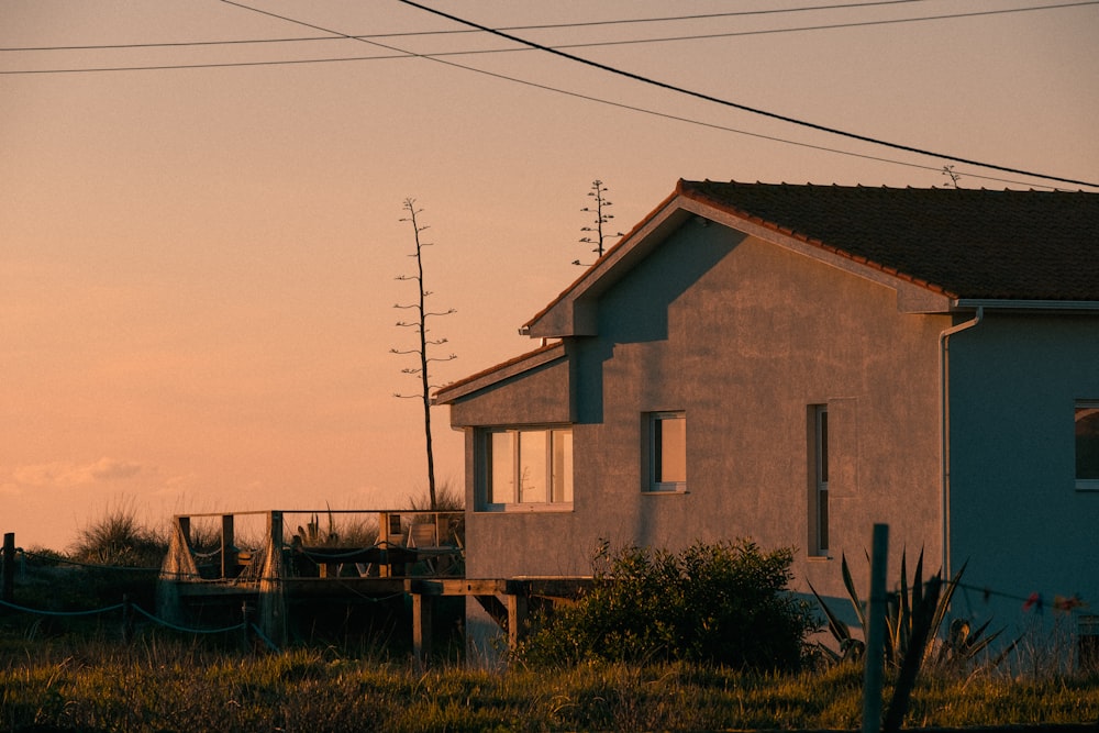 a house sitting in the middle of a field