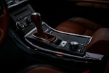 the interior of a car with a brown leather interior