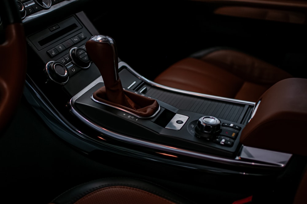 the interior of a car with a brown leather interior