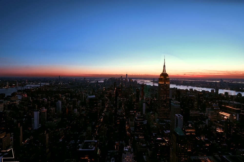 an aerial view of a city at sunset