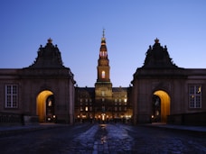a large building with a clock tower at night