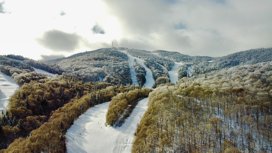 an aerial view of a snow covered mountain