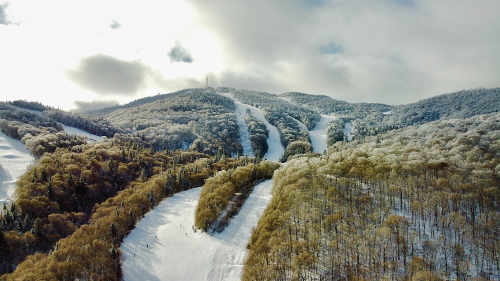 an aerial view of a snow covered mountain