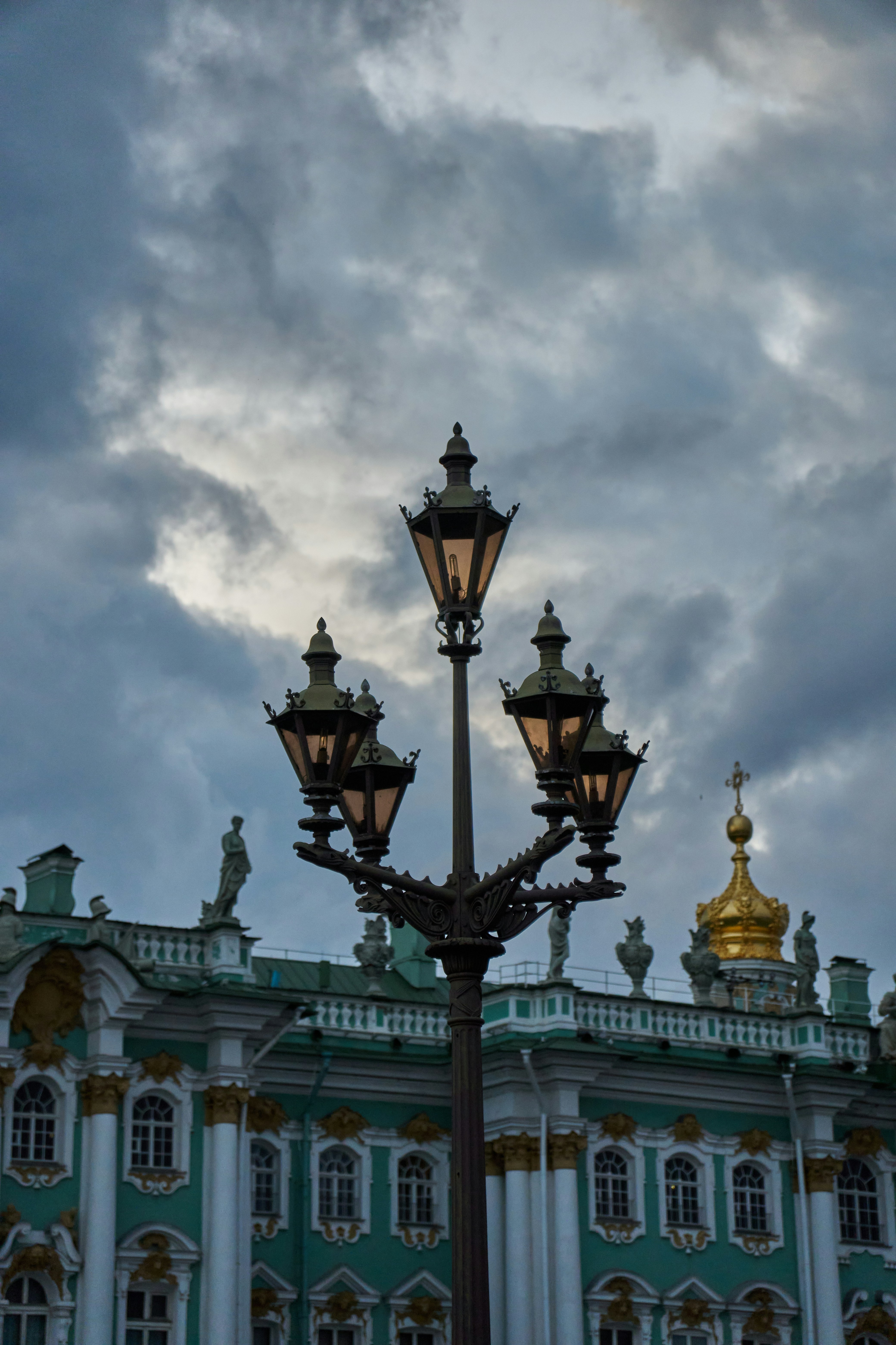 a street light in front of a large building