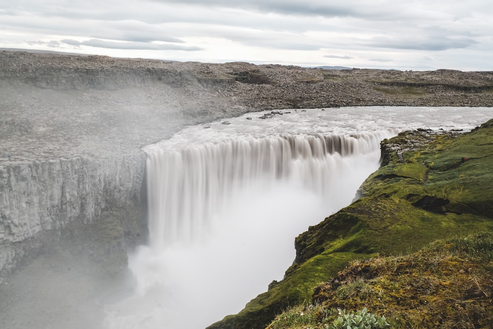 a large waterfall with water cascading over it