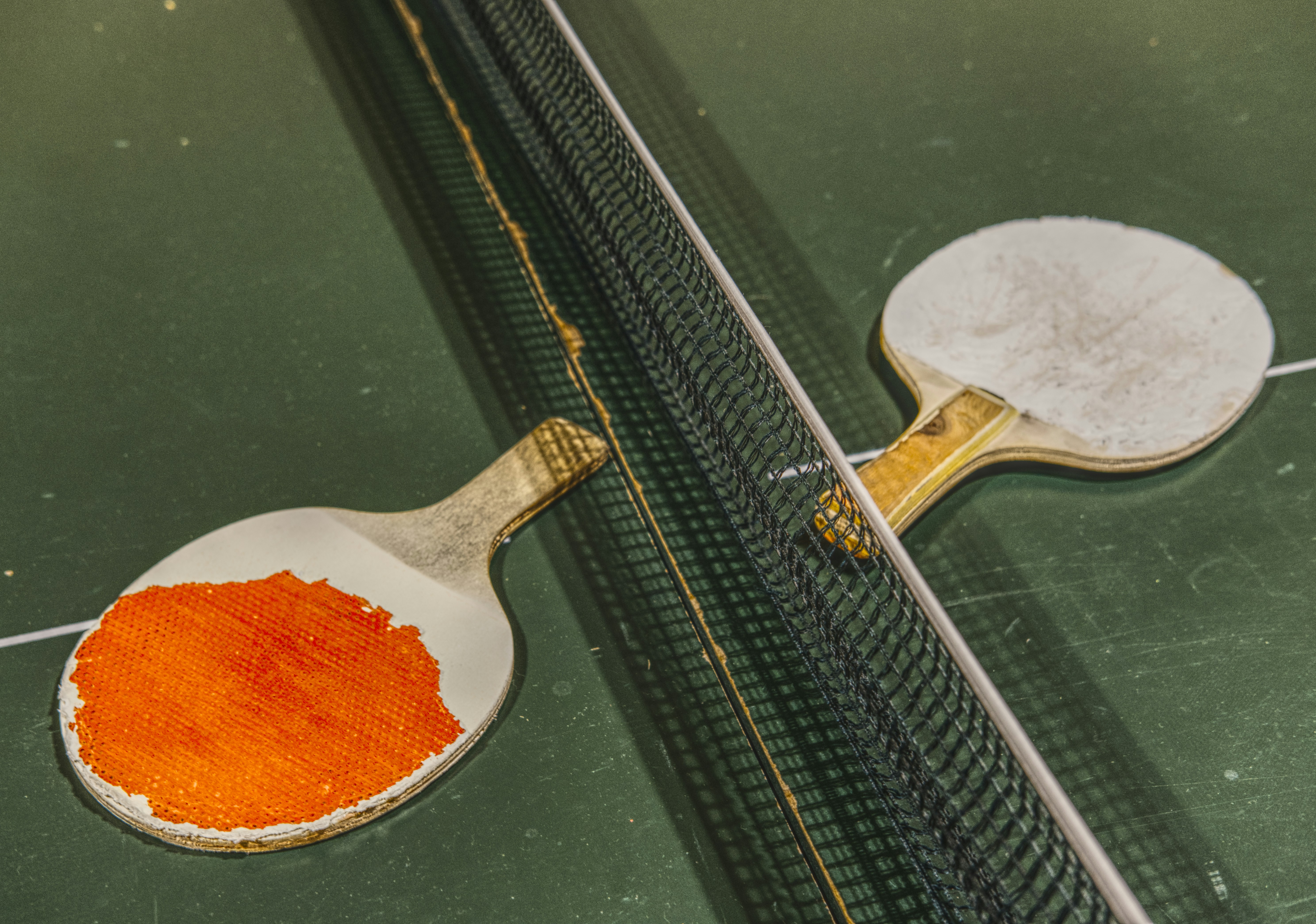 a close up of a table tennis racket and a ball