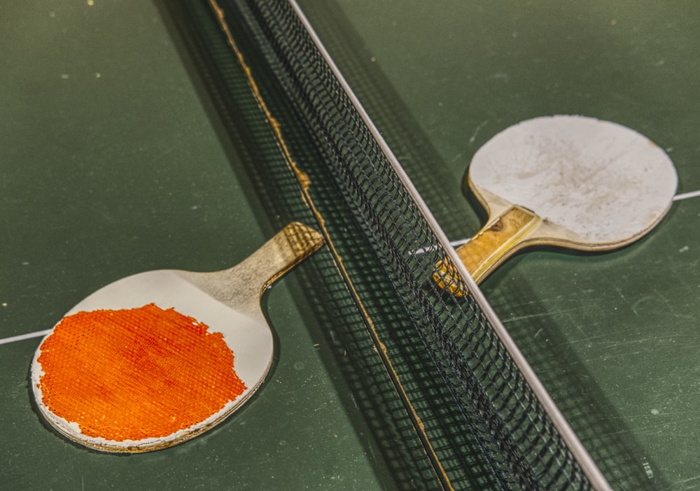a close up of a table tennis racket and a ball