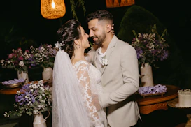 a bride and groom cutting their wedding cake