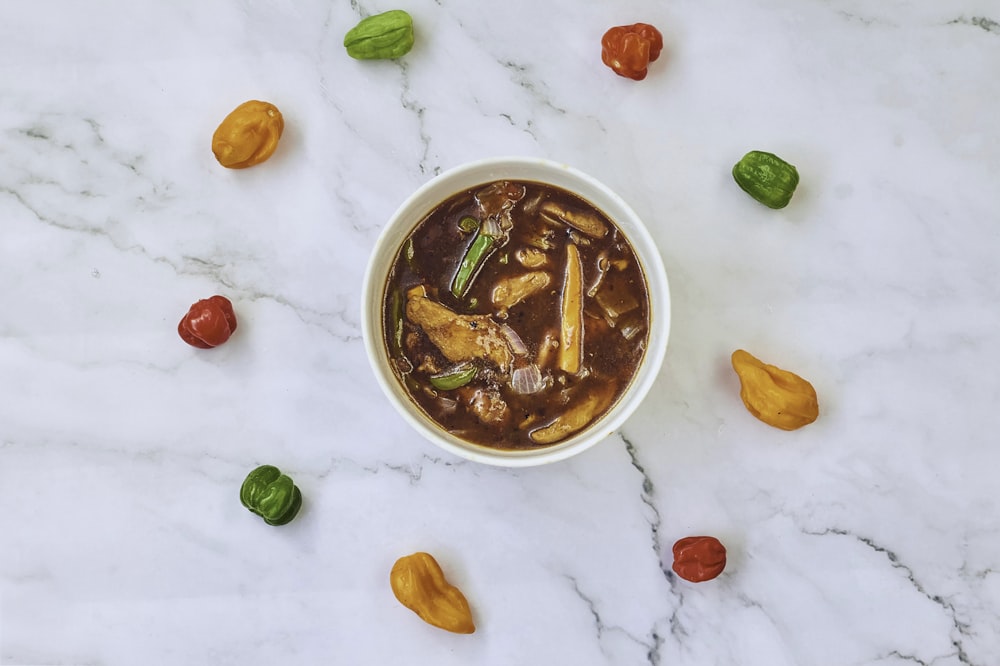 a bowl of food on a marble table