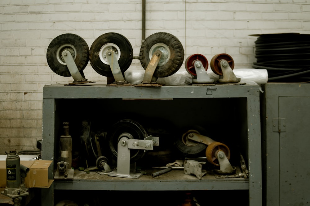 a bunch of wheels sitting on top of a shelf