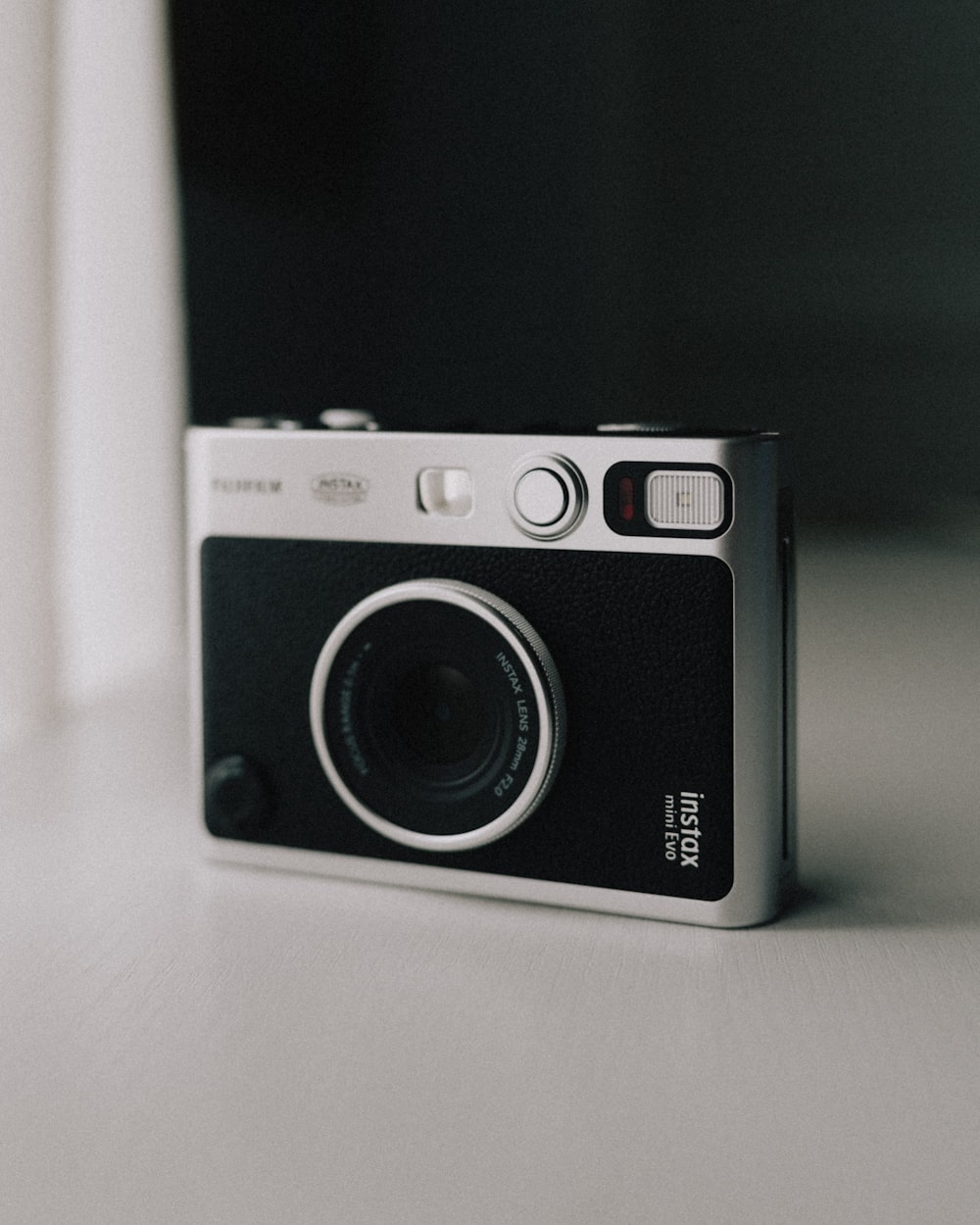 a black and white photo of a camera