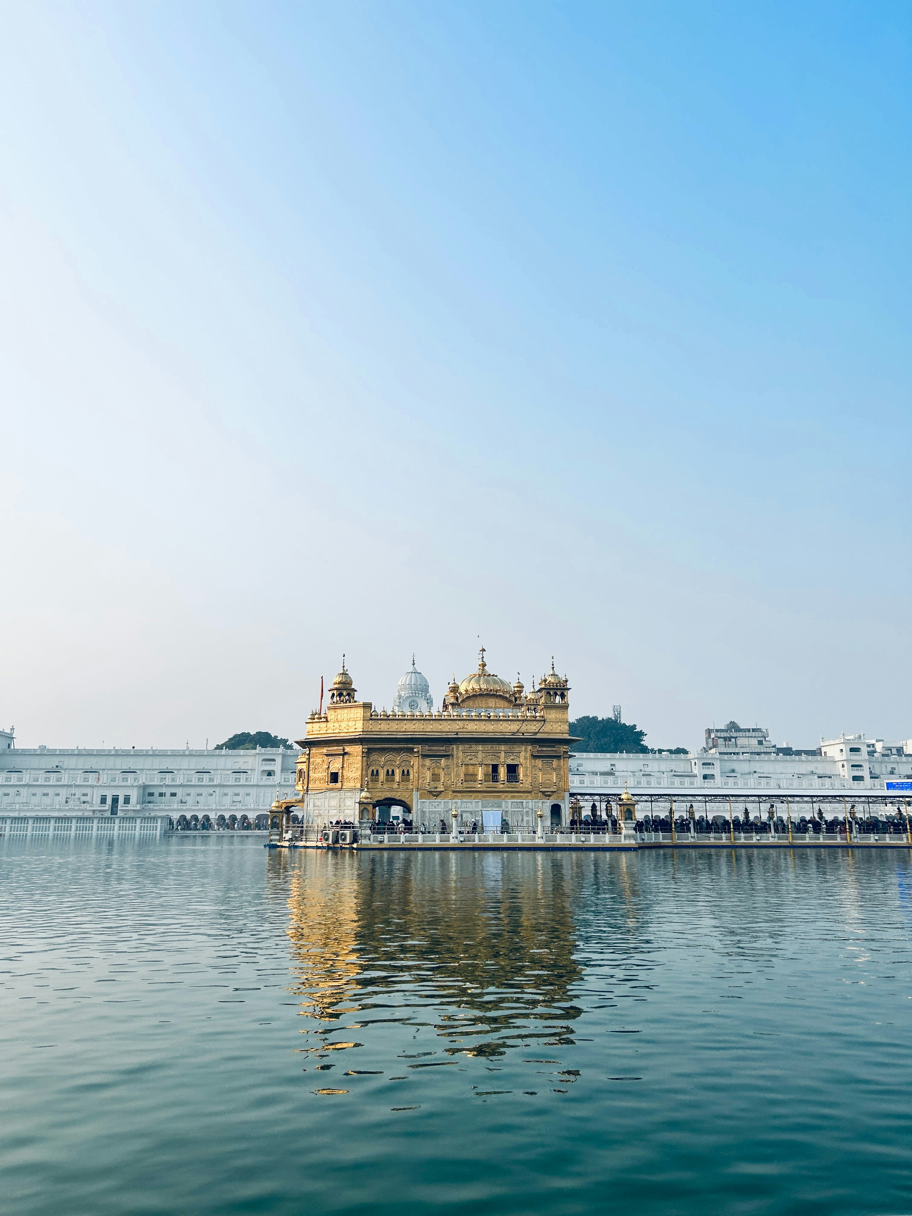 a large body of water with a building in the background