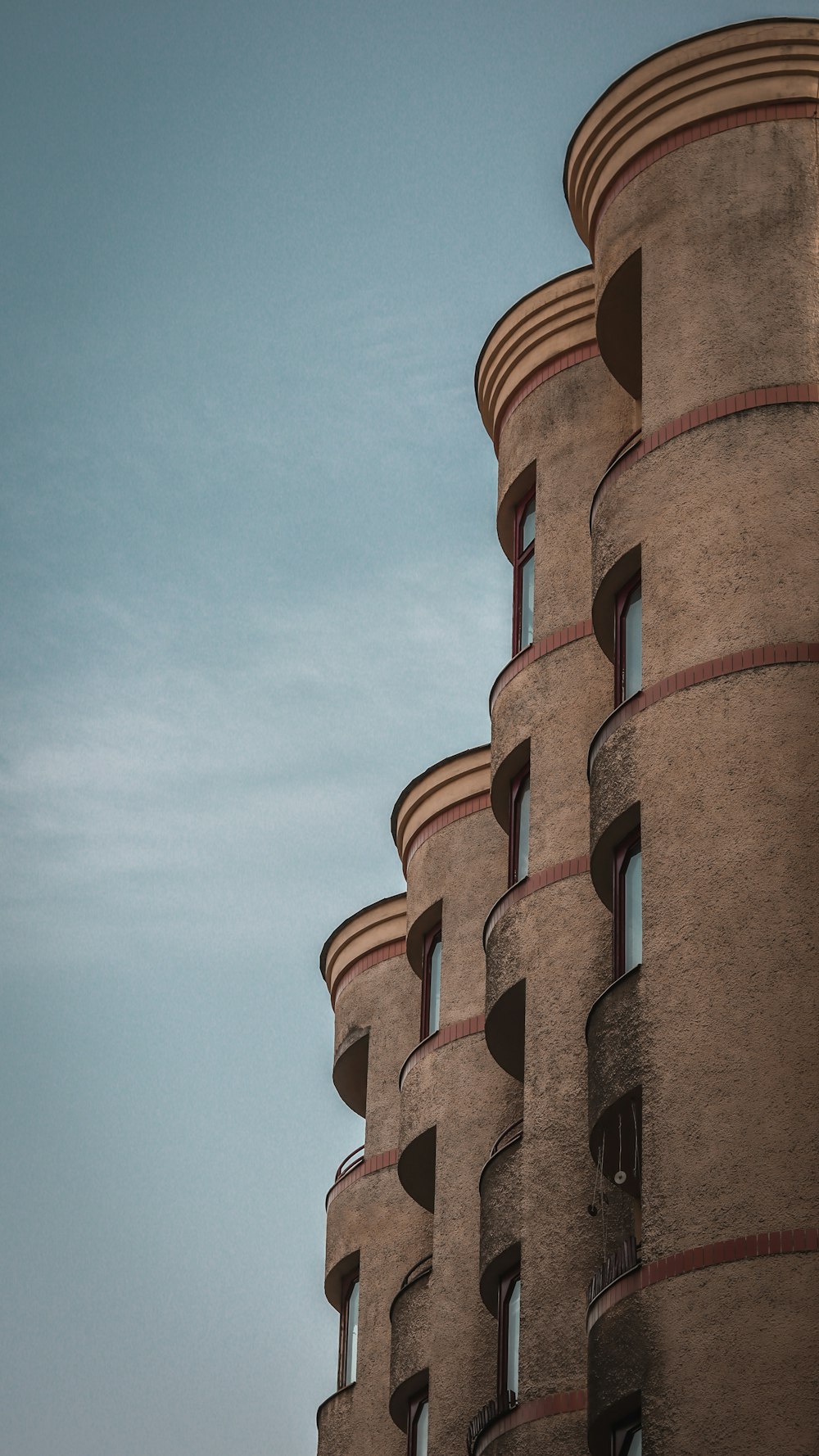 a tall building with a clock on the side of it