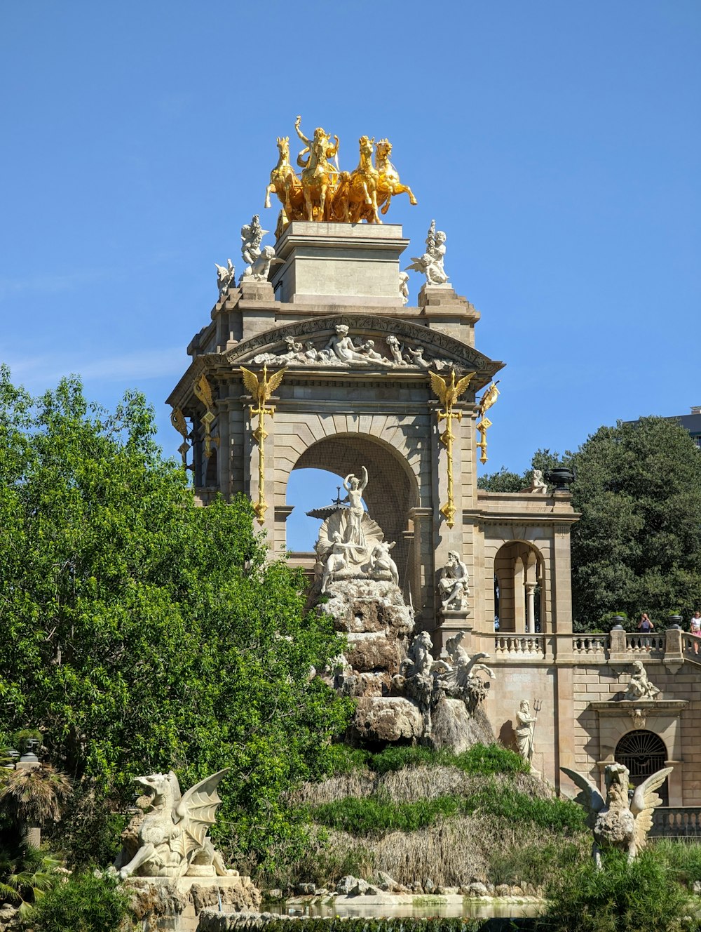 a large fountain with statues on top of it