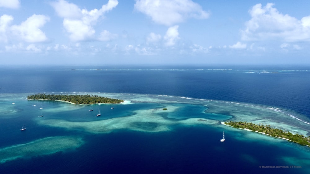 an aerial view of a small island in the middle of the ocean