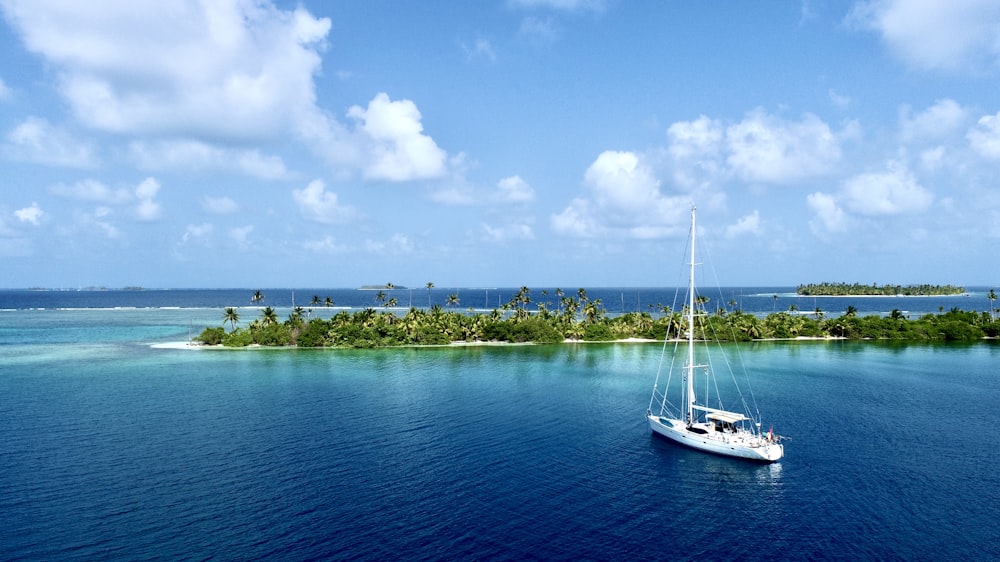 a sailboat in the middle of the ocean