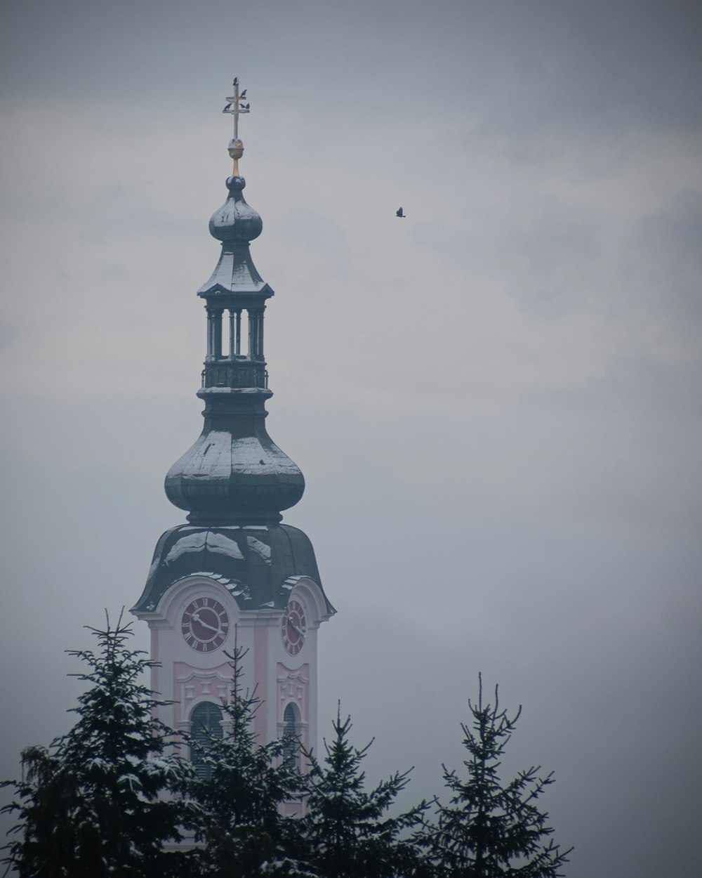 a church steeple with a clock on it