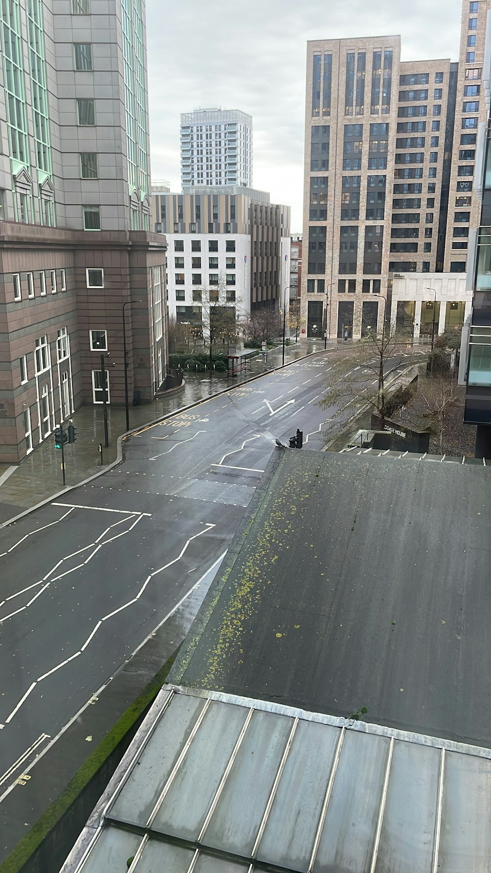 a view of a city street from a rooftop