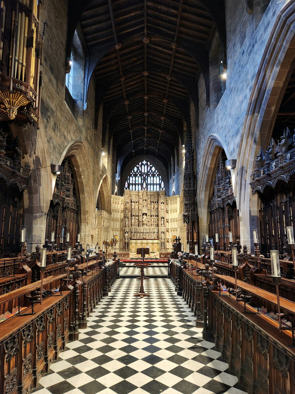 a large cathedral with a checkered floor and pews