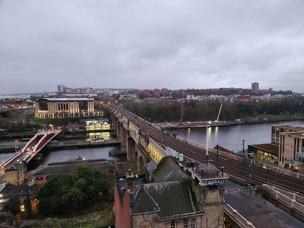 a view of a bridge over a river in a city