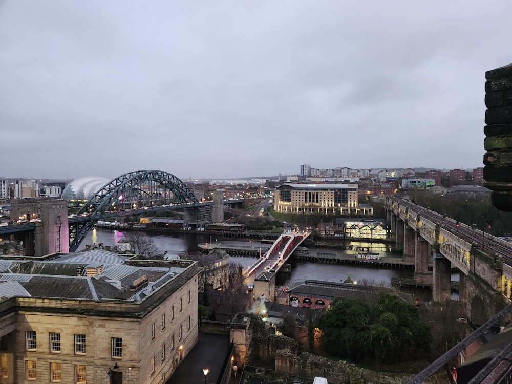 a view of a city with a bridge in the background