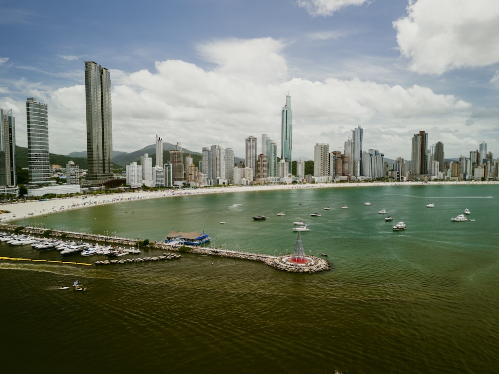 a large body of water with a city in the background