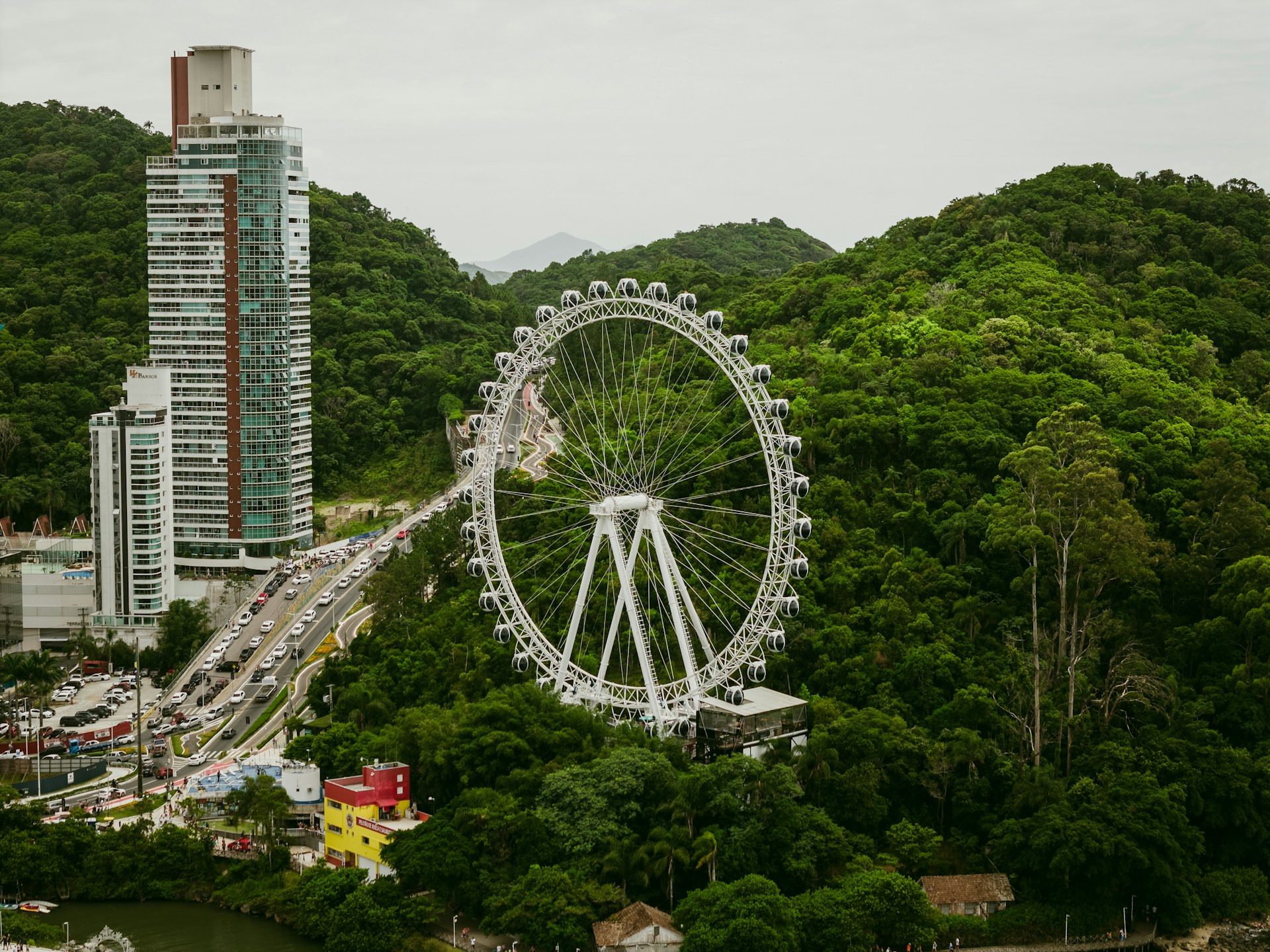 an aerial view of a ferris wheel in a city