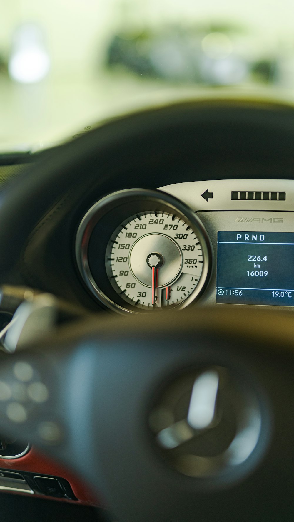 a close up of a car dashboard with a speedometer